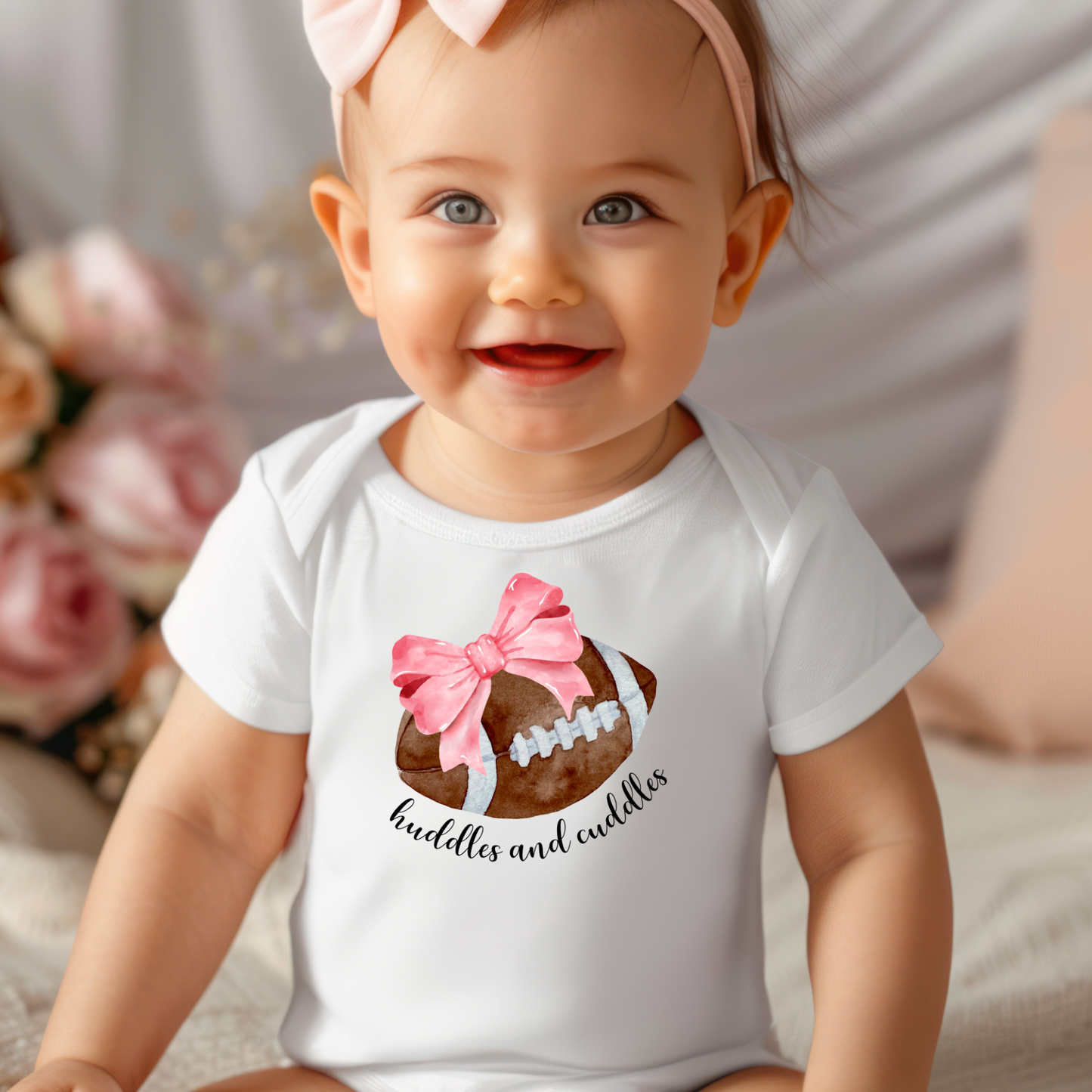 Huddles and Cuddles Football with Pink Bow Infant Bodysuit