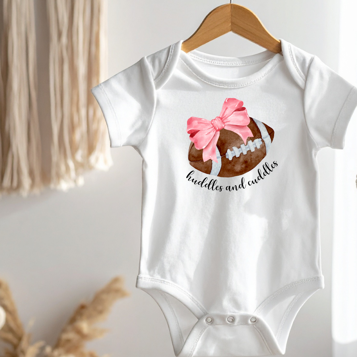 Huddles and Cuddles Football with Pink Bow Infant Bodysuit